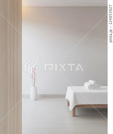 Relaxation space with clean white linens and minimal decor in a tranquil setting 124853927
