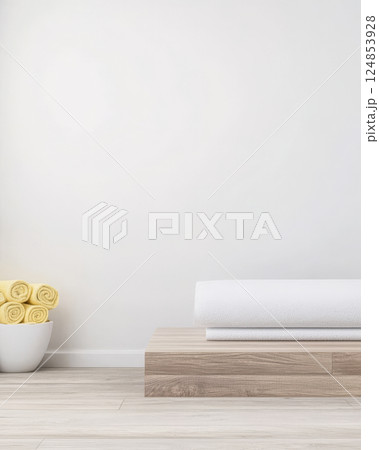 Minimalist spa interior with neatly arranged towels and yellow rolled towels 124853928
