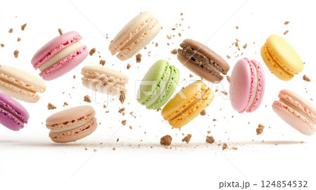 Colorful macarons of different flavors are levitating on a white background, surrounded by delicious crumbs, creating a visually appealing scene Colorful macarons of different flavors are levitating on a white background, surrounded by delicious crumbs, creating a visually appealing scene 124854532
