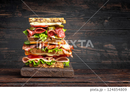Large mega sandwich with vegetables, meat and cheese 124854809