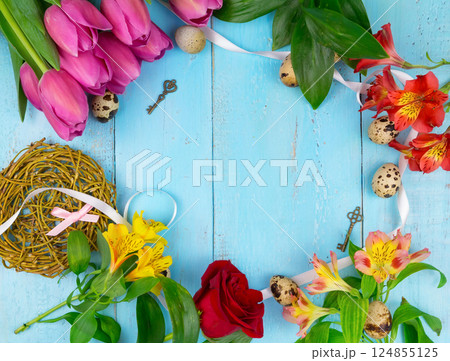Pink tulips on wooden blue background. Conception holiday, March 8, Mother's Day. Flat lay and copy space 124855125