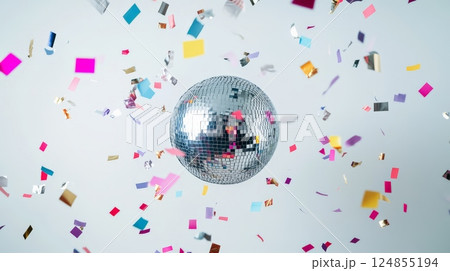 Colorful confetti falling around a rotating disco ball creates a festive atmosphere, perfect for celebrating special occasions and events with vibrant energy 124855194