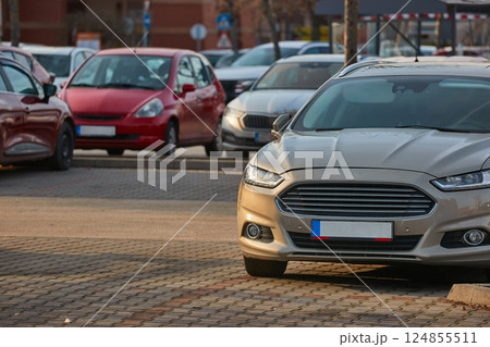Many cars parking in a carpark parking lot Many cars parking in a carpark parking lot 124855511