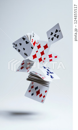 Several playing cards with different suits and values are levitating against a minimalist white backdrop, creating a dynamic and intriguing composition 124855517