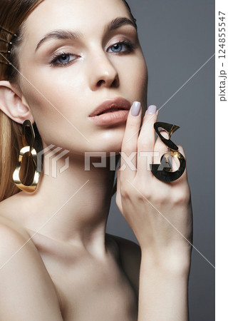 beautiful girl with Gold jewelry. Beauty Fashion Portrait beautiful girl with Gold jewelry. Beauty Fashion Portrait 124855547
