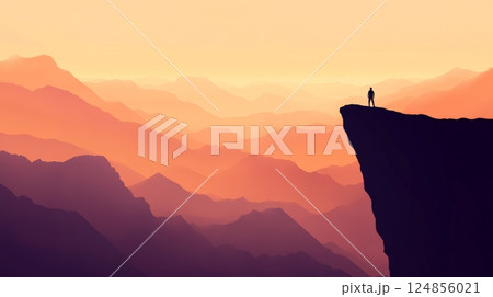 Hiker standing on a cliff is watching a majestic sunset over a mountain range, enjoying the breathtaking view and the warm colors of the evening sky 124856021