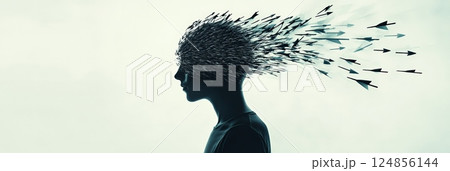 Silhouette profile of a young man with many arrows exploding from his head, representing the concept of fobo, fear of better option and difficulty in making decisions 124856144