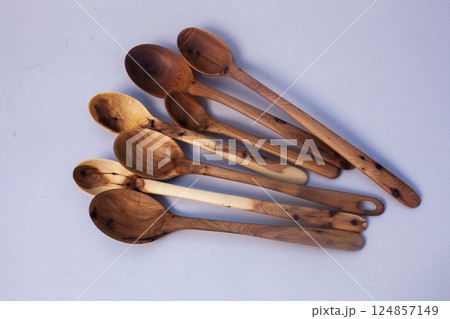 Wooden kitchen utensils stacked view isolated 124857149