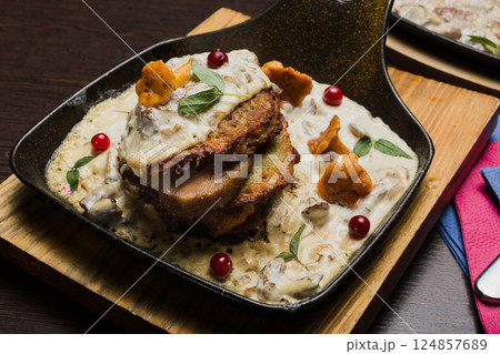 Draniki with chanterelle mushrooms, cream sauce Draniki with chanterelle mushrooms, cream sauce 124857689