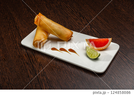 Japanese stuffed pancakes on a white plate with 124858086