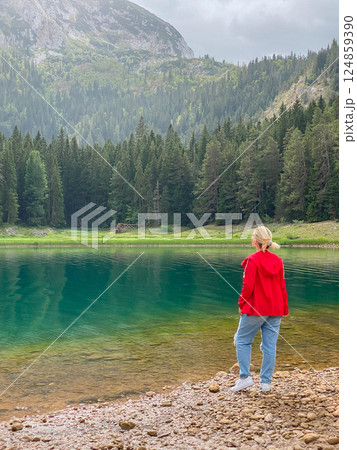 Woman in red windbreaker near the Black Lake in the Durmitor national park 124859390