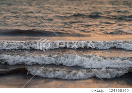 Gentle Waves on Calm Sea at Dusk Gentle Waves on Calm Sea at Dusk 124860149