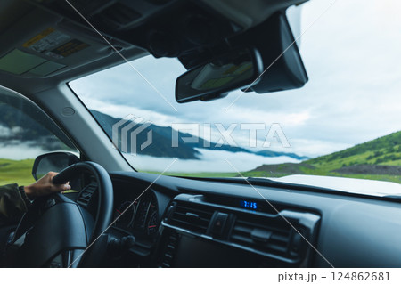 Driving offroad car on high elevation mountains Driving offroad car on high elevation mountains 124862681