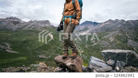 Woman hiker hiking in winter hugh glacier mountain,China 124862991