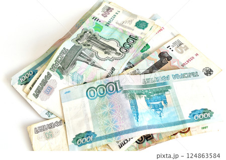 Russian currency is lying on the table 124863584