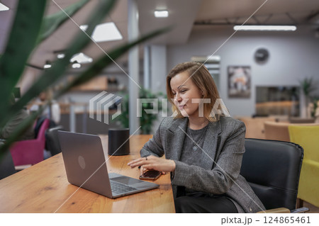 Woman Laptop Office, working in modern workspace for career development, daytime. Woman Laptop Office, working in modern workspace for career development, daytime. 124865461