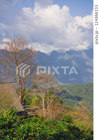 landscape and travel concept with sunlight and cloudy sky with country house on mountain landscape and travel concept with sunlight and cloudy sky with country house on mountain 124866333