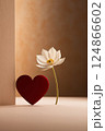 A red heart and a white flower sit next to each other 124866602