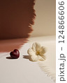 On the table, there is a beautiful heart and a vibrant flower 124866606