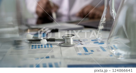 Medical insurance business doctor analyzing growth 124866641