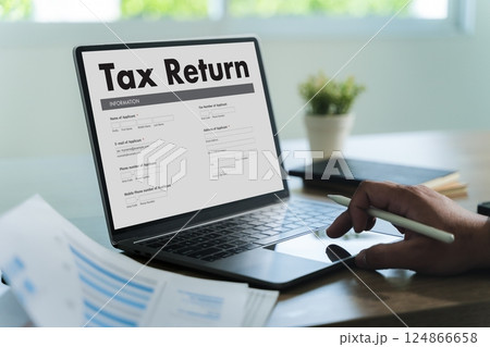 tax return Business person using a laptop Tax tax return Business person using a laptop Tax 124866658