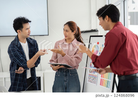 Creative Conflict Resolution and Team Dynamics. Professionals navigate differing opinions during a design discussion. 124868096