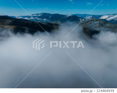 Aerial view of beautiful high altitude grassland mountain landscape Aerial view of beautiful high altitude grassland mountain landscape 124868939