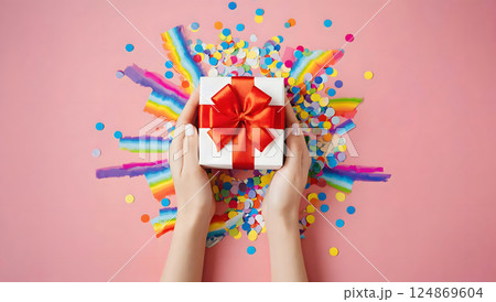 Female hands holding a gift boxes. Presents wrapped with ribbon and bow. Christmas or birthday packages. 124869604