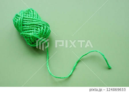 Green ball of yarn. Complexity of thoughts and interconnected ideas. 124869633
