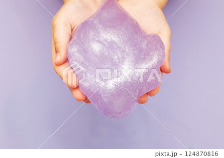 Making slime at home. child stretching colorful slime. DIY concept. Making slime at home. child stretching colorful slime. DIY concept. 124870816