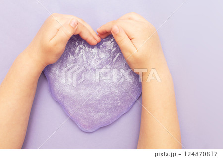 Making slime at home. child stretching colorful slime. DIY concept. Making slime at home. child stretching colorful slime. DIY concept. 124870817