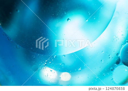 Oil bubbles close up. circles of water macro. abstract light blue background Oil bubbles close up. circles of water macro. abstract light blue background 124870838