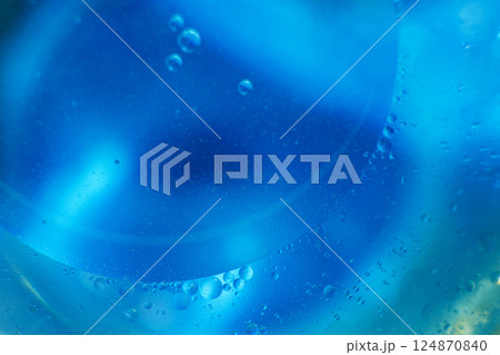Oil bubbles close up. circles of water macro. abstract light blue background Oil bubbles close up. circles of water macro. abstract light blue background 124870840