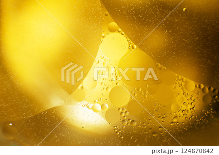 Gold Oil bubbles. circles of orange water macro. abstract yellow background 124870842