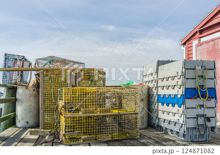 Lobster traps and fishing equipment on a pier in Maine, USA 124871082