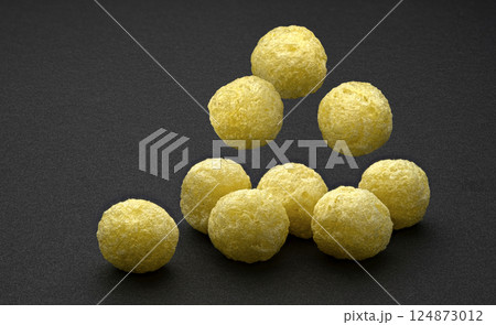 Falling corn balls isolated on black background with copy space, full depth of field Falling corn balls isolated on black background with copy space, full depth of field 124873012