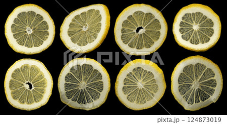 Falling lemon slices on black background, collection of citrus cuts 124873019