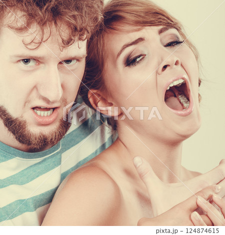 Angry man strangling screaming woman, violence 124874615