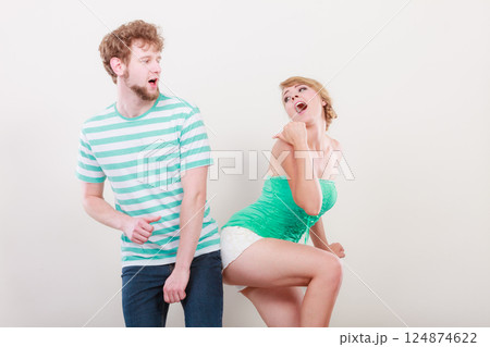 Playful young couple blonde girl bearded man 124874622