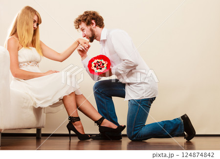 Man giving woman candy bunch flowers. Happy couple 124874842