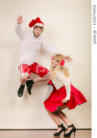 Happy active couple dancing and jumping. Happy active couple dancing and jumping. 124874858