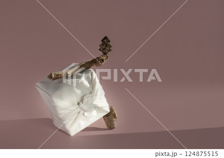 Zero waste gift wrapping traditional Japanese furoshiki style over grey background 2022. Zero waste gift wrapping traditional Japanese furoshiki style over grey background 2022. 124875515