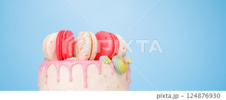 A beautifully decorated cake adorned with colorful macarons A beautifully decorated cake adorned with colorful macarons 124876930