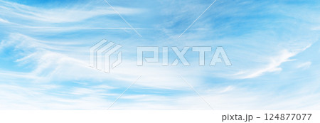 Majestic sunny sky with scattered small clouds 124877077