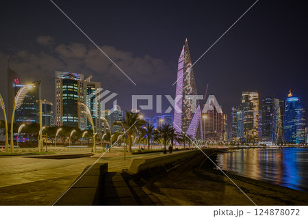 Doha, Qatar-March 12 2025:Doha Qatar skyline from corniche promenade at night in the West Bay area Doha, Qatar-March 12 2025:Doha Qatar skyline from corniche promenade at night in the West Bay area 124878072