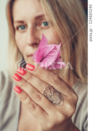 Beautiful mid age woman showing red shellac manicure on nails . Beautiful mid age woman showing red shellac manicure on nails . 124883240