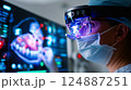 Dentist analyzing a complex, futuristic digital interface displaying a detailed 3D scan 124887251