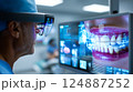 Dentist analyzing a complex, futuristic digital interface displaying a detailed 3D scan 124887252