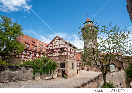 Nuremberg, Germany, August 1, 2023. Stunning footage of the castle overlooking the city. Beautiful summer day, people walk along the castle walls. Travel destinations 124887766