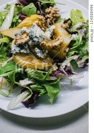 A flavorful Fresh Salad that includes juicy Pears, crunchy Walnuts, and tangy Blue Cheese A flavorful Fresh Salad that includes juicy Pears, crunchy Walnuts, and tangy Blue Cheese 124888494